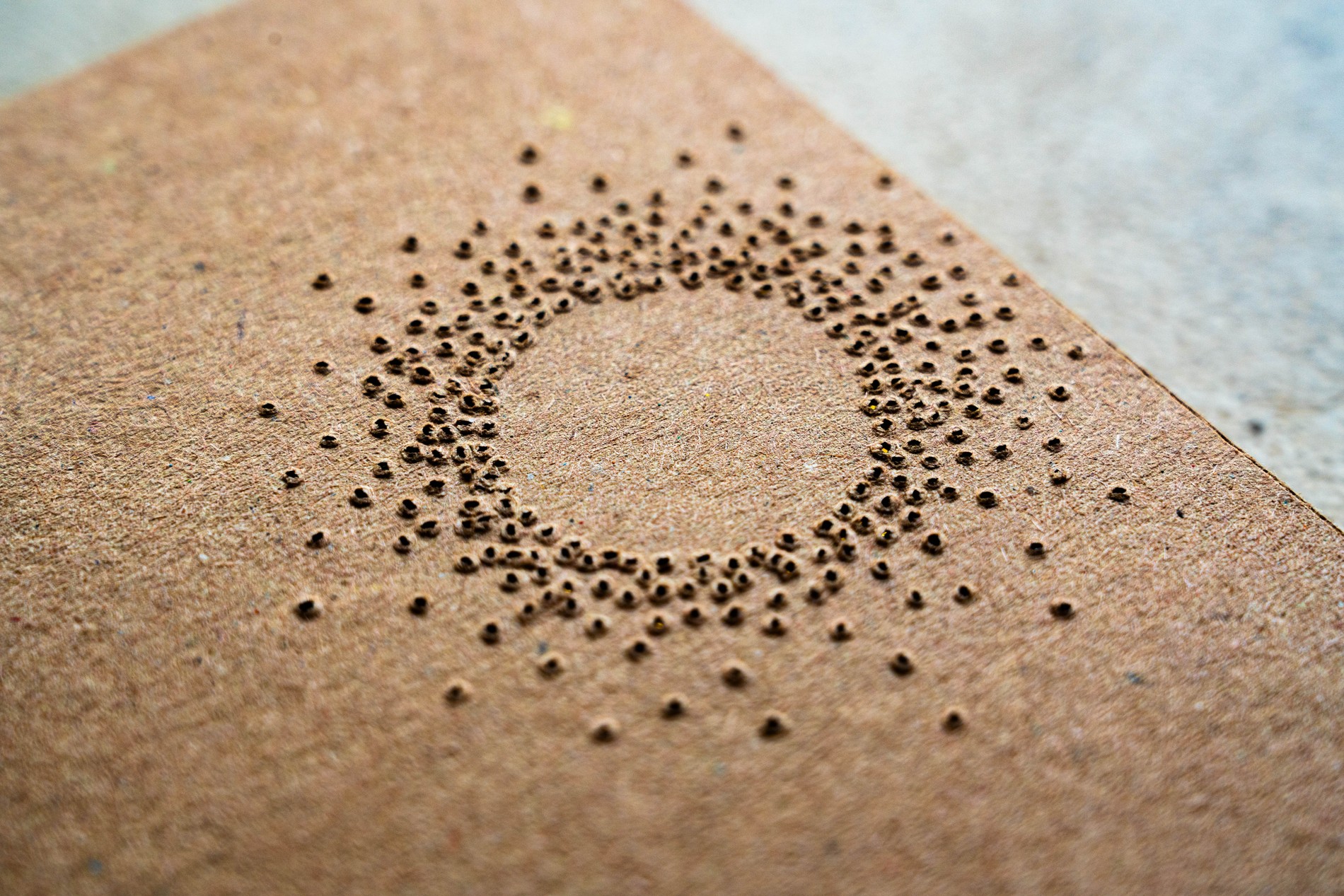 Point of Light packaging, 70% cocoa perforation pattern, holes arranged in a wide ring