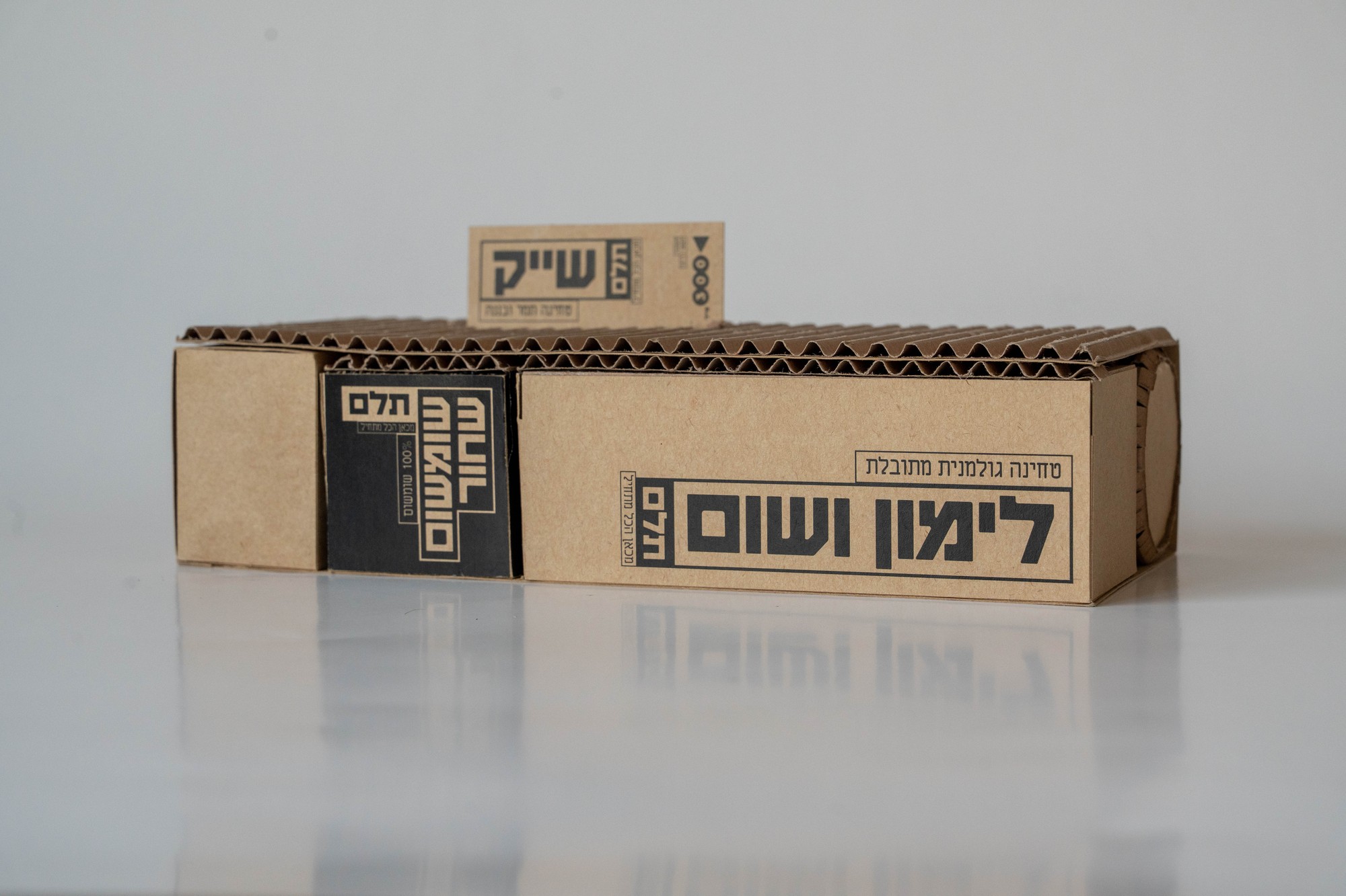 Telem product kit, multiple packages grouped on corrugated cardboard