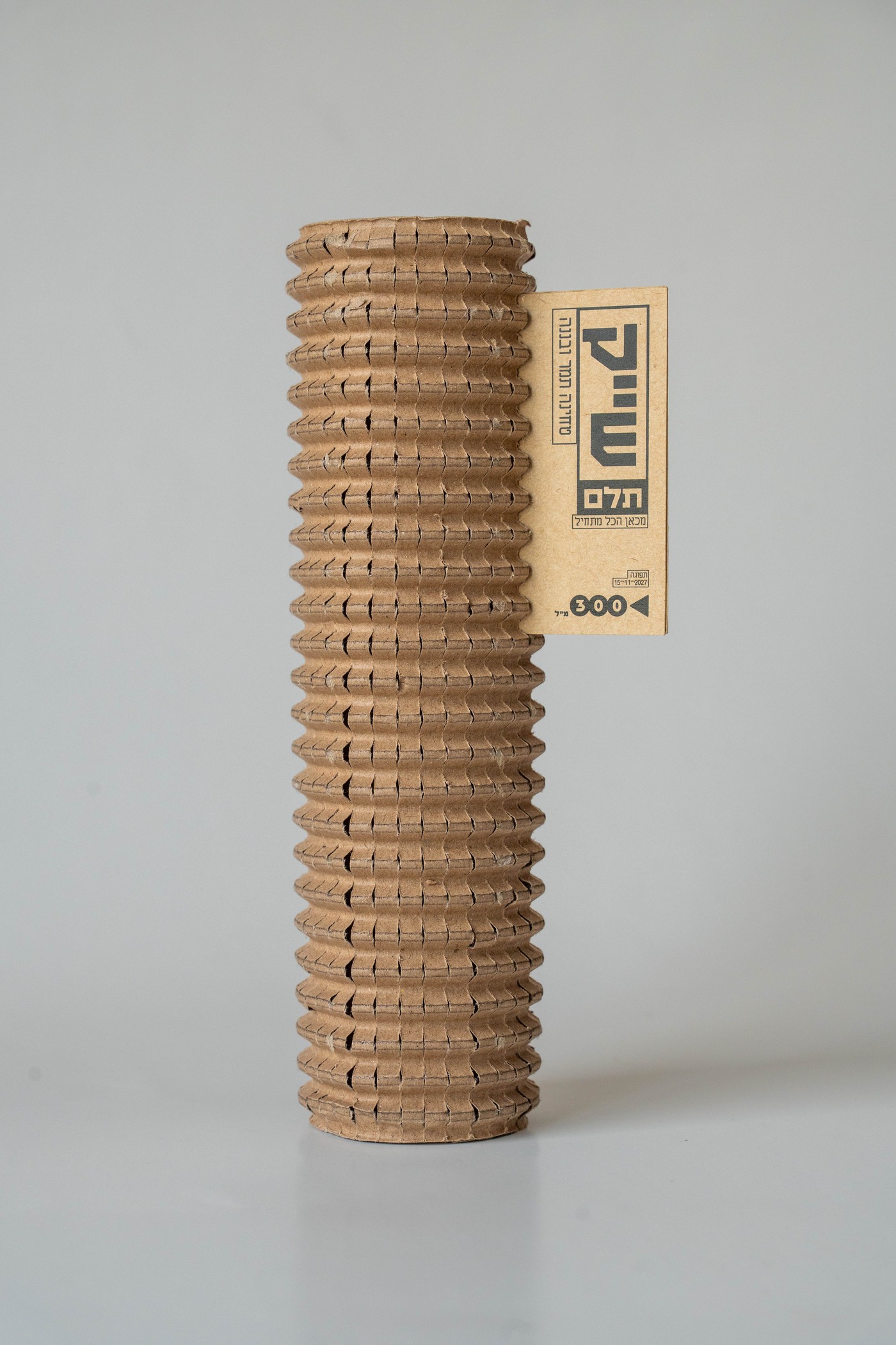 Telem shake tube package, tall corrugated cylinder with hanging label