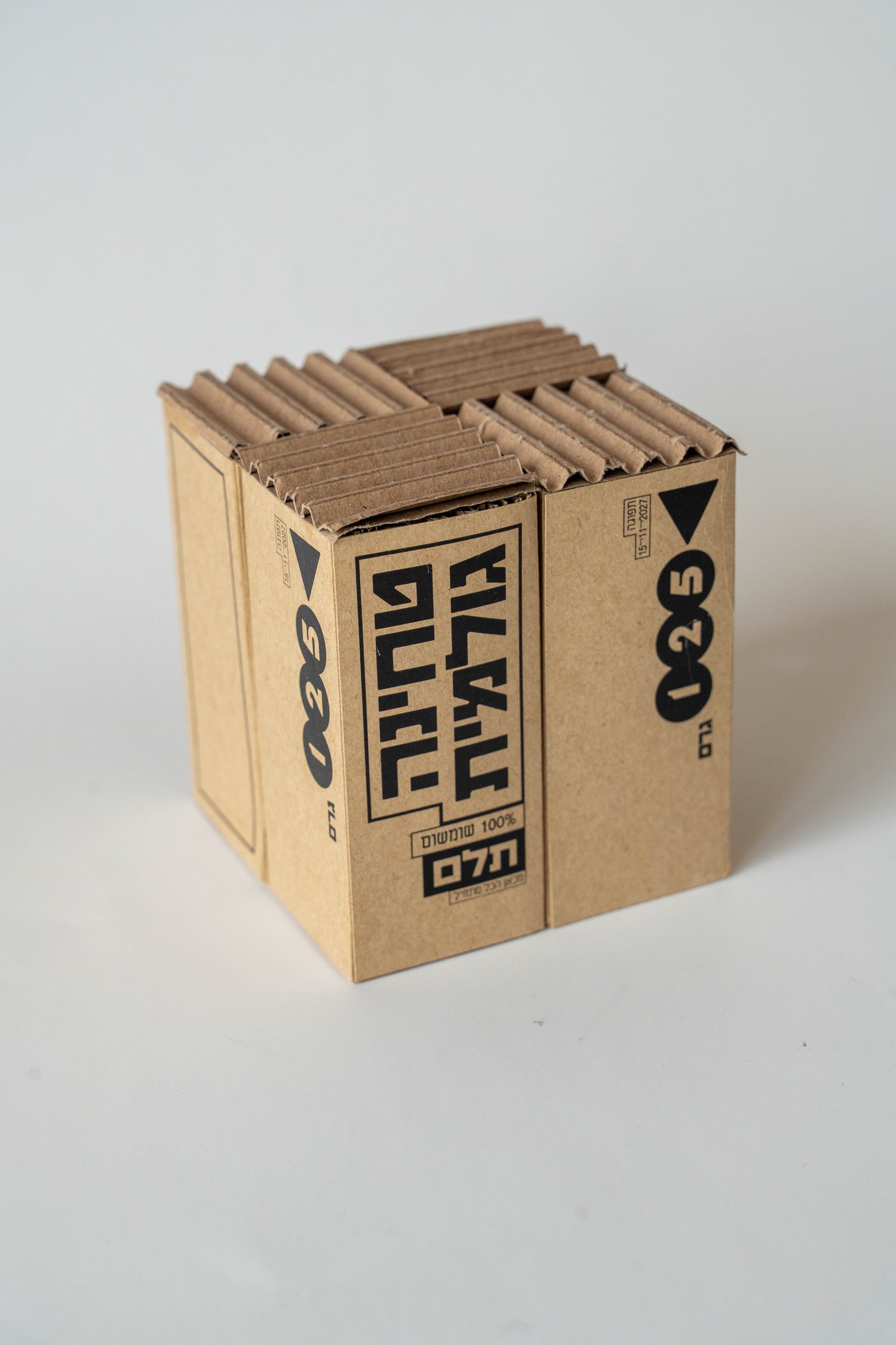 Telem raw tahini box at an angle, corrugated top edge visible