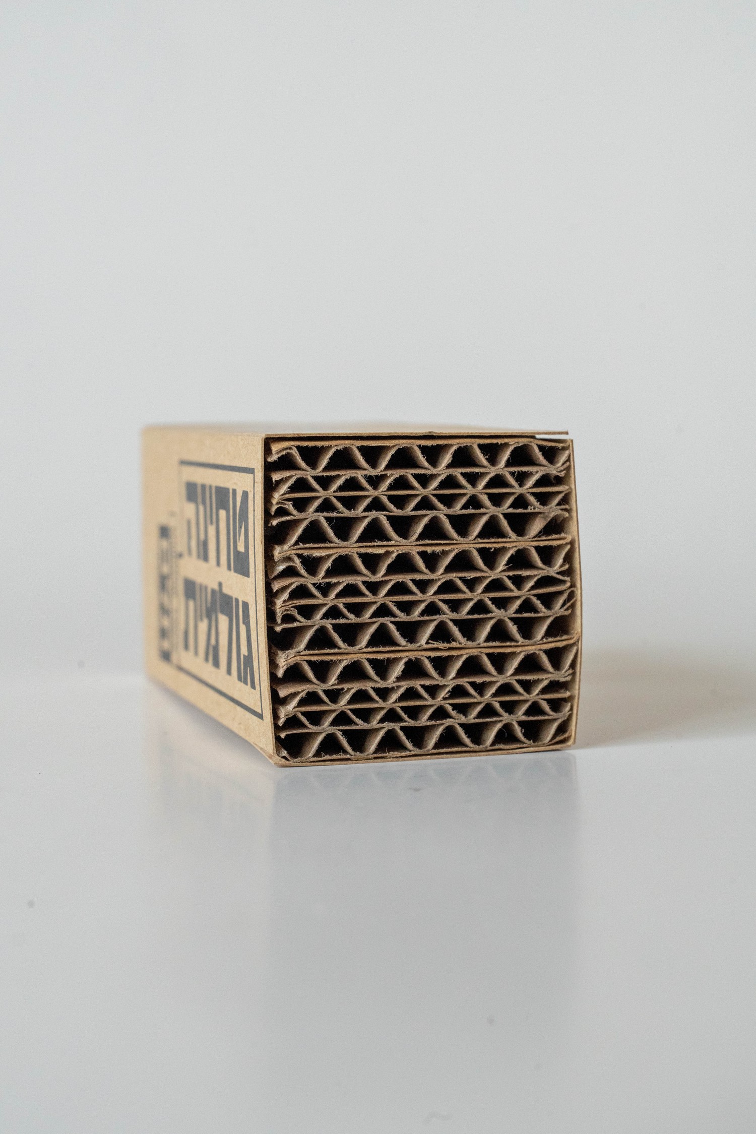 Telem raw tahini box, front-facing with corrugated top edge